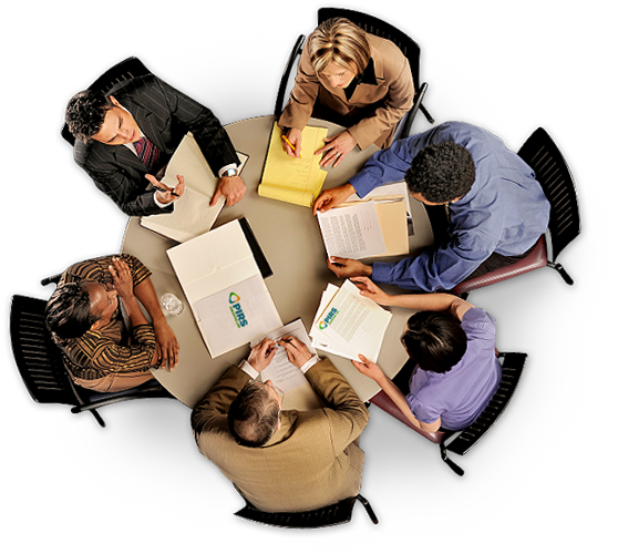 grafika - spojrzenie od góry na okrągły stół za którym siedzi 6 osób. Widać, że to kobiety i mężczyźni różnych ras.